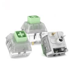 Three green switches on a white background.


