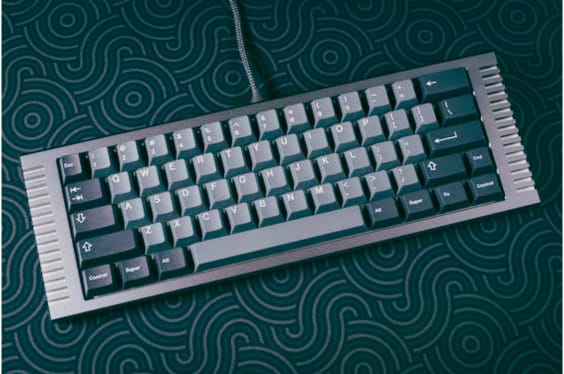 Image of a computer custom keyboard on a blue background.


