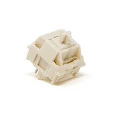 A NovelKeys Cream mechanical keyboard switch. The switch has a cream-colored top and a white housing. It is a linear switch with a 63.5g actuation force.

